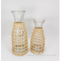 large ratten wrapped clear glass bottles with handle